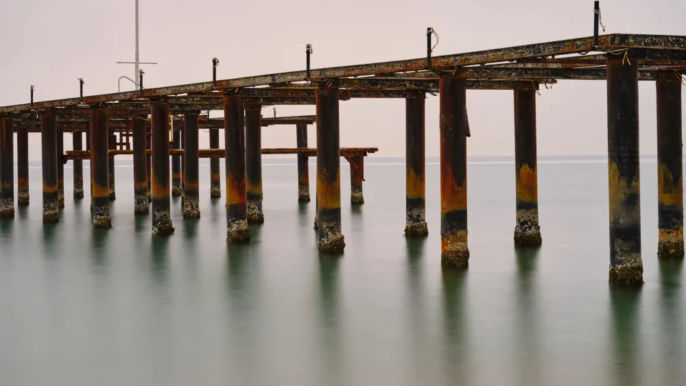 akyurt, engin: old pier on the beach and long exposure sea waves