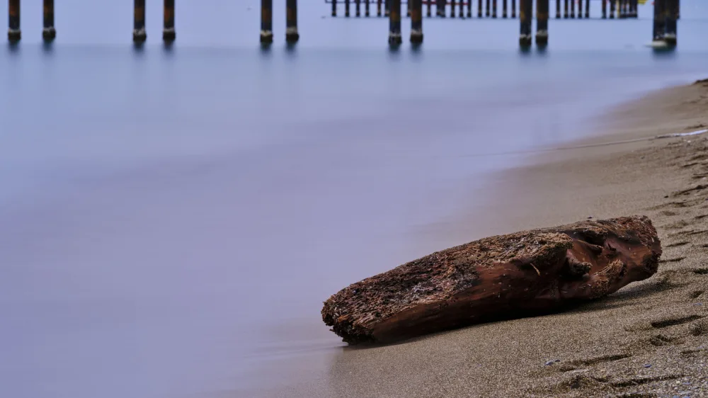 akyurt, engin: old pier on the beach and long exposure sea waves
