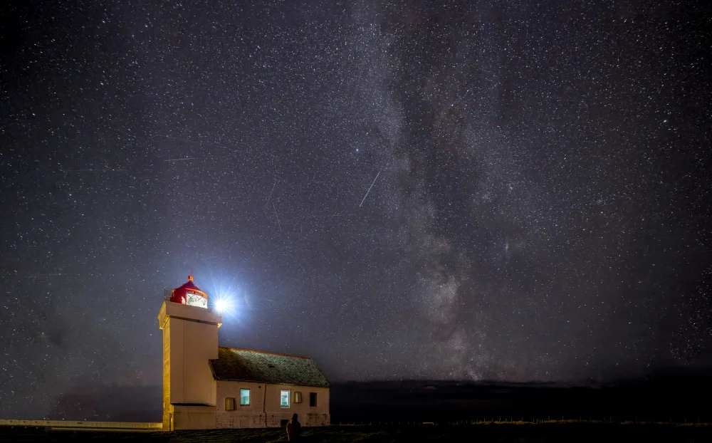 Khan, Zaheer: Milky way and meteor shower over Obrestad fyr