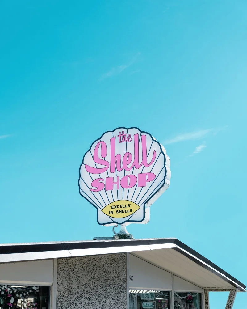 Windeknecht, Tom: Cartel vintage de tienda de conchas