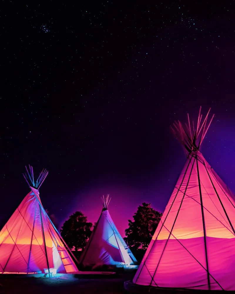 Windeknecht, Tom: Vaporwave Teepees Glowing at Night Under Stars In Marfa Texas