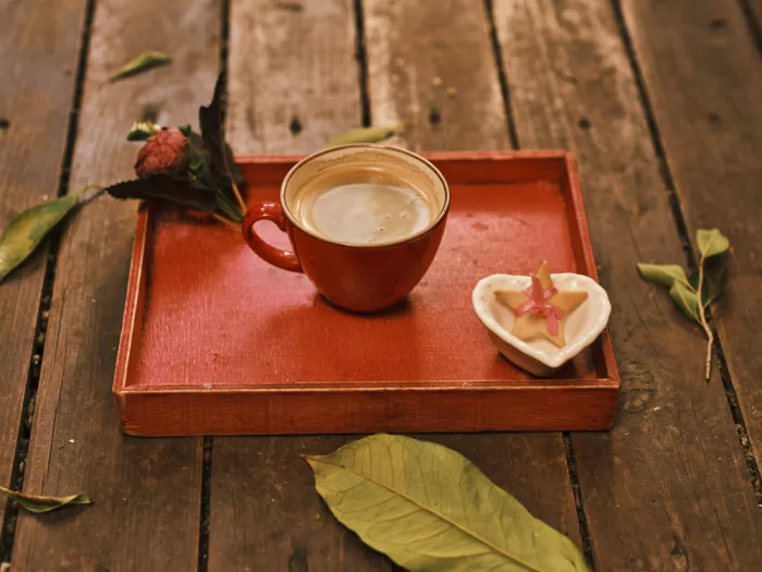 akyurt, engin: a hot fresh coffee on a red wooden tray