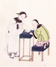 Chinese Schoo: Girl Looking for Luck into a Bowl of Water